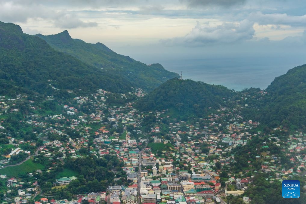 Houses on Mahe Island, Seychelles, are pictured through an airplane window on June 24, 2026. Mahe Island, the largest among all islands of the nation, is home to the capital city Victoria and a renowned tourist destination. (Photo: Xinhua)