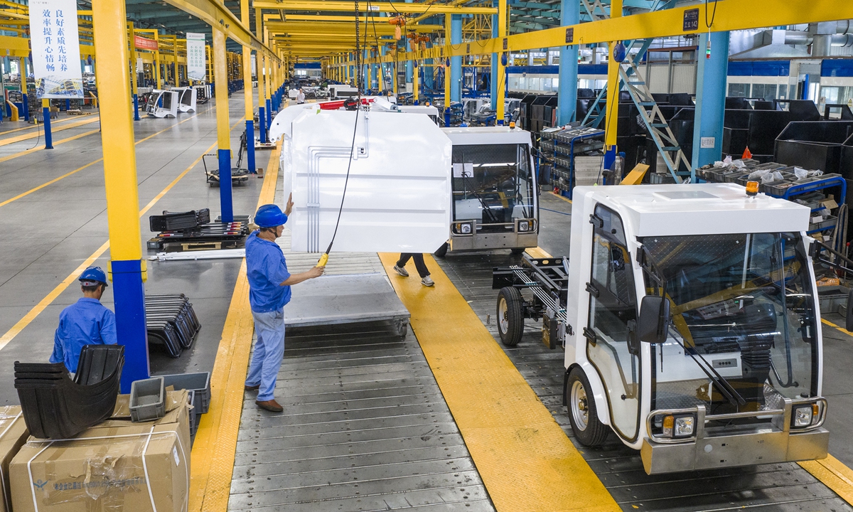 Workers assemble electric street sweepers at the final assembly workshop of a new-energy vehicle factory in Fanchang Economic Development Zone, Wuhu, East China's Anhui Province, on July 1, 2026. Enterprises across the region have been operating at full capacity to fulfill orders and meet market demand. Photo: VCG