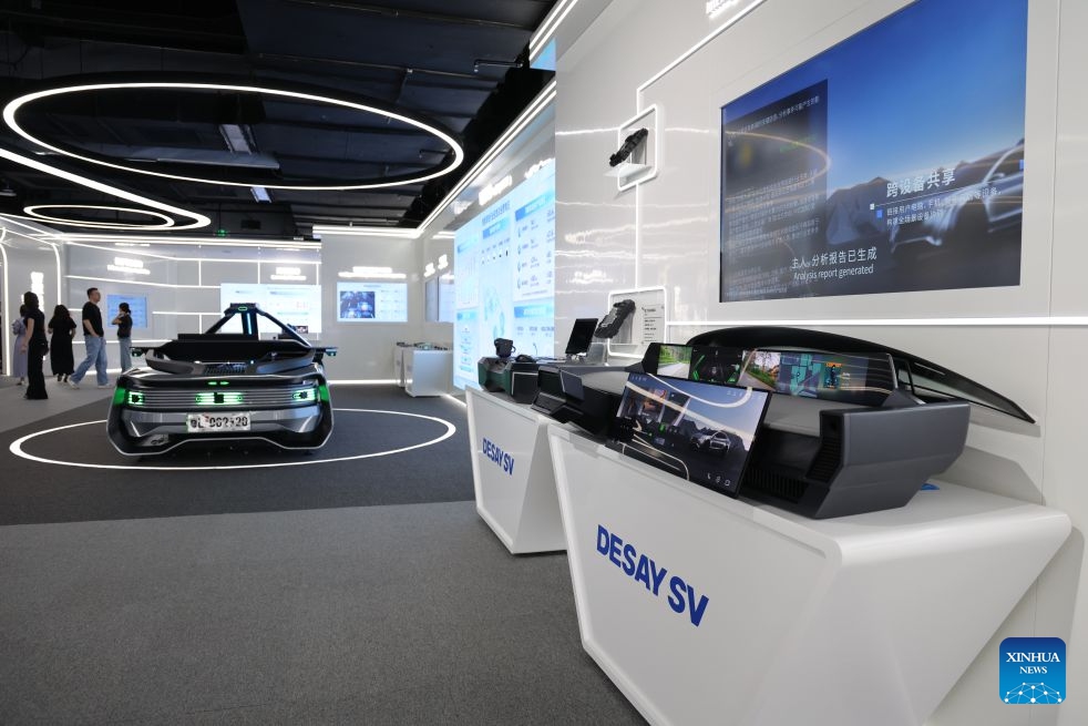 People learn about products at Desay SV, a leading smart mobility technology company, in Huizhou, south China's Guangdong Province, June 30, 2026. (Xinhua/Liang Xu)