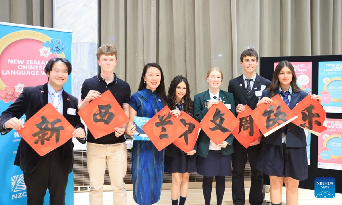 Chinese language enthusiasts and a member of Parliament pose for a group photo during the opening ceremony of the New Zealand Chinese Language Week 2026 in Wellington, New Zealand, on June 30, 2026. An opening ceremony was held on Tuesday evening for the New Zealand Chinese Language Week 2026 at the Parliament Buildings in Wellington, with over 50 events scheduled in one week across the country. (Photo by Meng Tao/Xinhua)