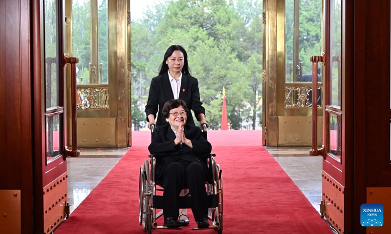 Zhong Jue, recipient of the July 1 Medal, enters the Great Hall of the People in Beijing, capital of China, July 1, 2026. China will hold a gathering to celebrate the 105th founding anniversary of the Communist Party of China (CPC) at 10 a.m. Wednesday at the Great Hall of the People in Beijing. (Xinhua/Yin Bogu)