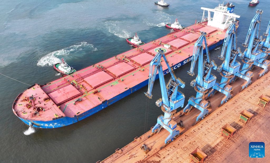 An aerial drone photo taken on July 1, 2026 shows CSB Glory, a bulk carrier under COSCO Shipping, docking an ore terminal of the Tianjin Port in north China's Tianjin. Measuring 330 meters long and 57 meters wide, the bulk carrier under COSCO Shipping set a new record on Wednesday with its maximum draft of 22.18 meters among all ships ever docked at Tianjin Port. (Photo: Xinhua)