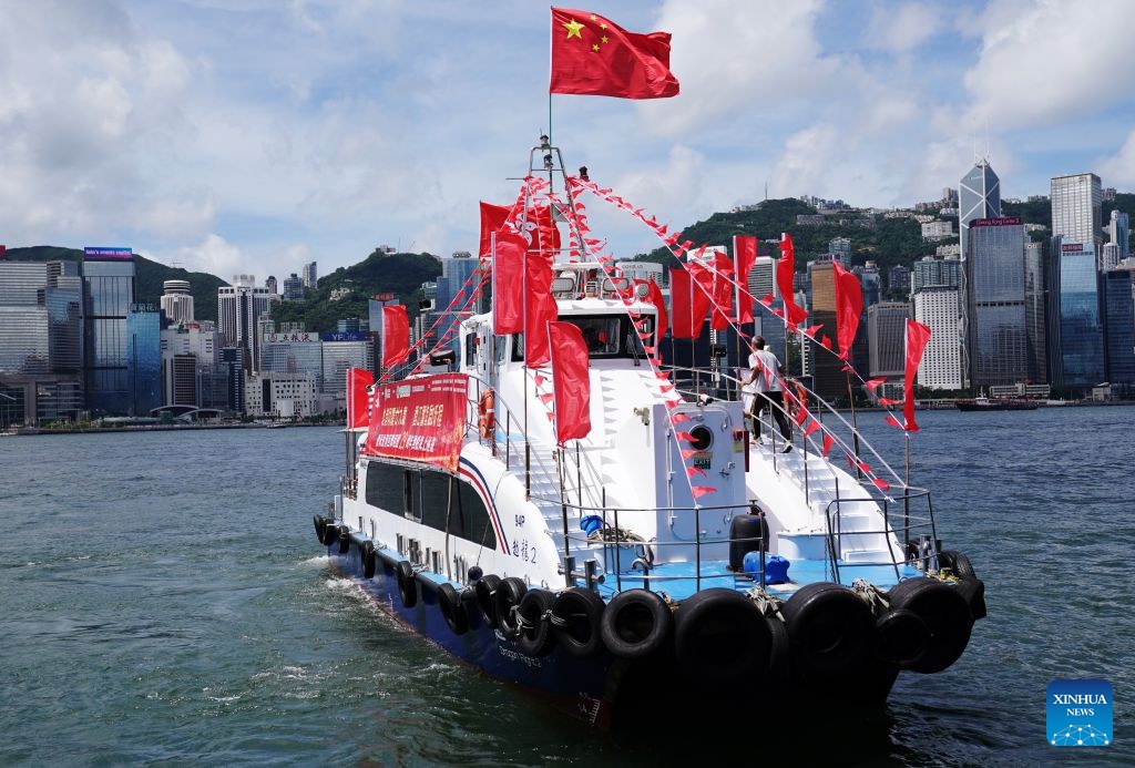 A fishing vessel takes part in a cruise held by the Hong Kong Fishermen Consortium to celebrate the 29th anniversary of Hong Kong's return to the motherland at Victoria Harbour in Hong Kong, south China, July 1, 2026. (Photo: Xinhua)