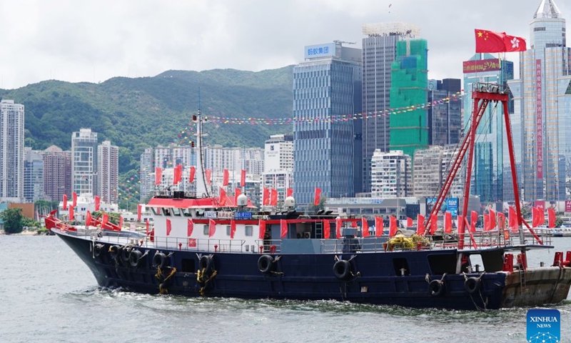 A fishing vessel takes part in a cruise held by the Hong Kong Fishermen Consortium to celebrate the 29th anniversary of Hong Kong's return to the motherland at Victoria Harbour in Hong Kong, south China, July 1, 2026. (Photo: Xinhua)