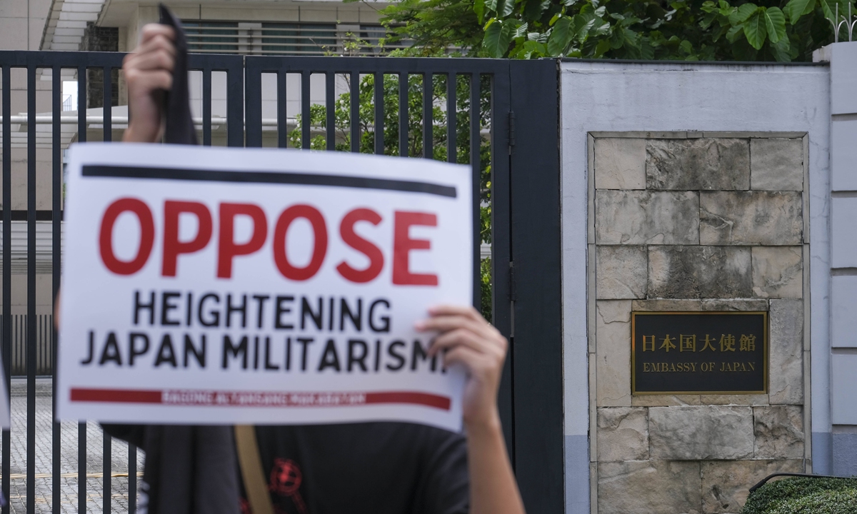 People protest outside the Japanese Embassy in Manila, the Philippines, against Japan's growing militarism tendencies.