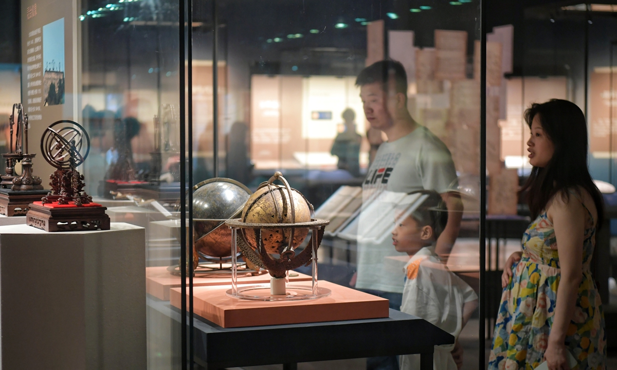 Visitors view astronomical instruments and cultural relics during the Heavenly Questions: The Cosmological Vision of Chinese Civilization exhibition at the Anhui Museum in Hefei, Anhui Province on July 2, 2026. Photo: VCG