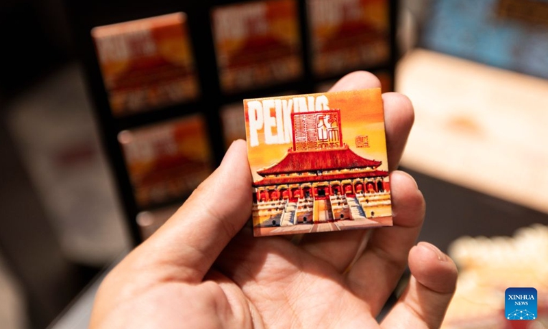 Souvenir products are seen during the exhibition The Forbidden City: Six Centuries of Mystery in Paris, France, on June 30, 2026. (Photo: Xinhua)