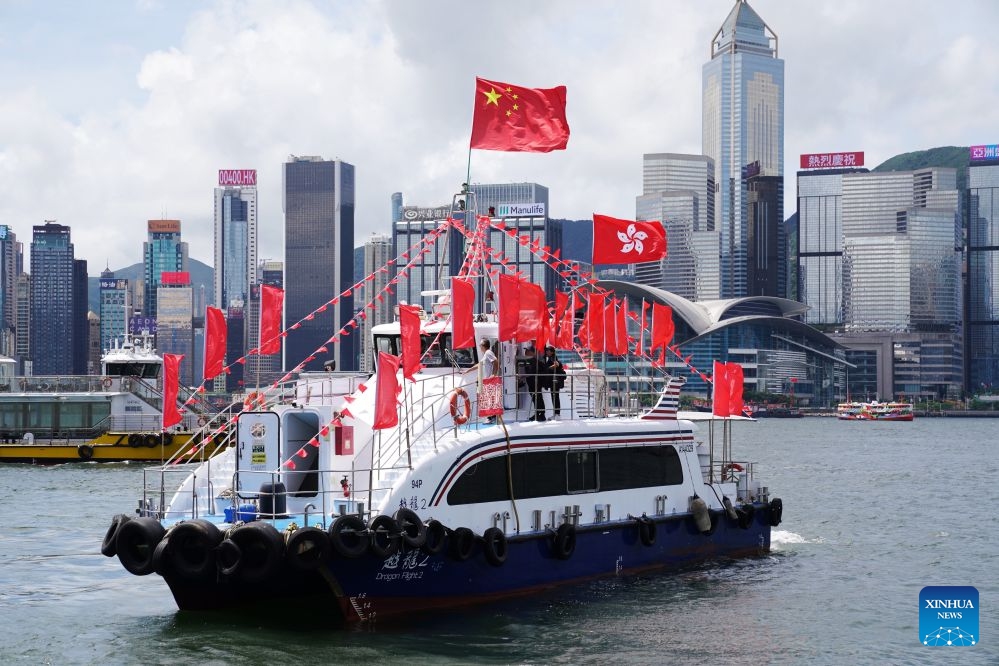 A fishing vessel takes part in a cruise held by the Hong Kong Fishermen Consortium to celebrate the 29th anniversary of Hong Kong's return to the motherland at Victoria Harbour in Hong Kong, south China, July 1, 2026. (Photo: Xinhua)