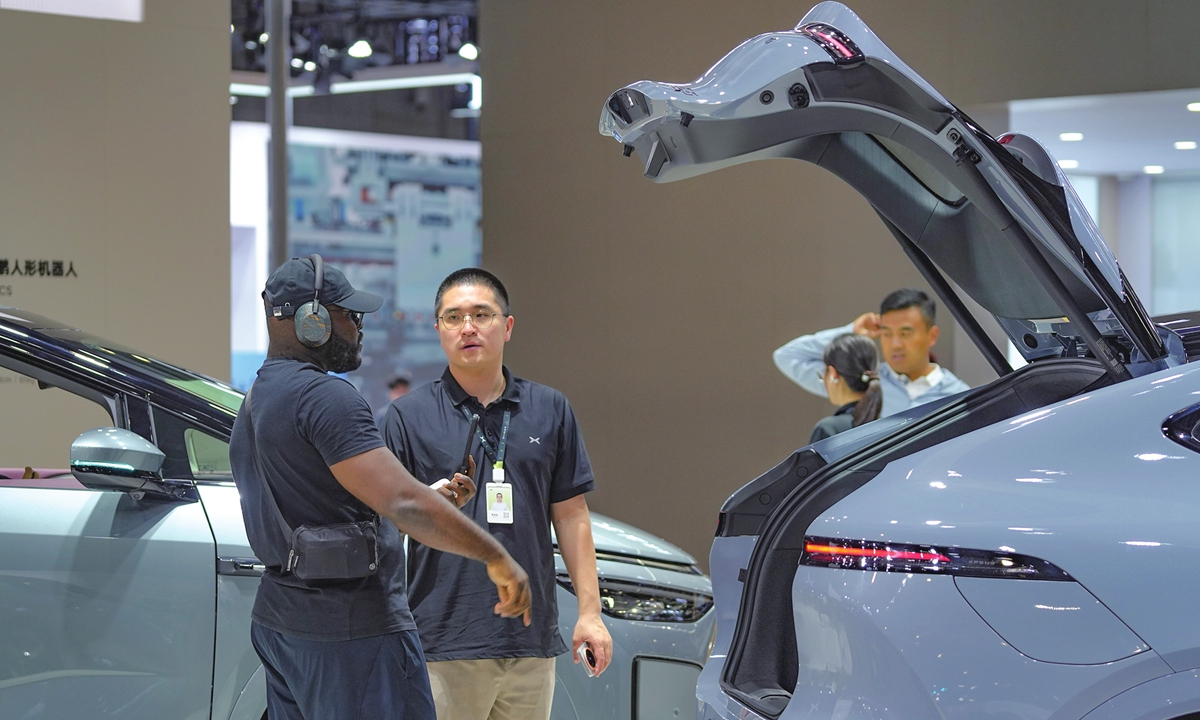Visitors view cars at the Green and Smart Auto Shanghai 2026 held in Shanghai on July 2, 2026. Running through Sunday, the auto show spans a total exhibition area of 60,000 square meters and features nearly 200 participating companies, showcasing more than 40 well-known domestic and international automotive brands. Photo: Lu Ting/GT