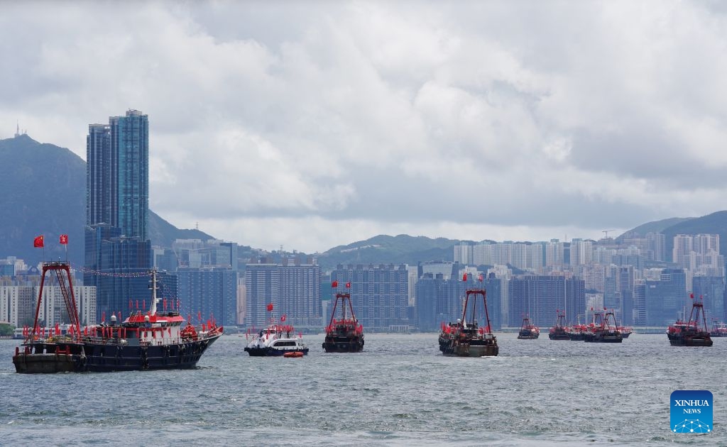 Fishing vessels take part in a cruise held by the Hong Kong Fishermen Consortium to celebrate the 29th anniversary of Hong Kong's return to the motherland at Victoria Harbour in Hong Kong, south China, July 1, 2026. (Photo: Xinhua)