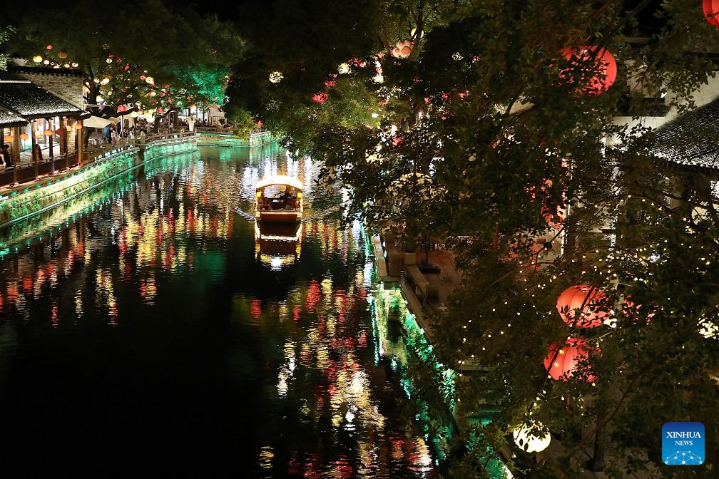 This photo taken on July 2, 2026 shows the night scenery in Huishan Yingyueli area in Wuxi City, east China's Jiangsu Province. Opened in 2025, the Huishan Yingyueli area, inspired by the famous Erhu solo piece Er Quan Ying Yue (Two Springs Reflecting the Moon), is now a beloved local leisure resort. (Xinhua/Lu Peng)