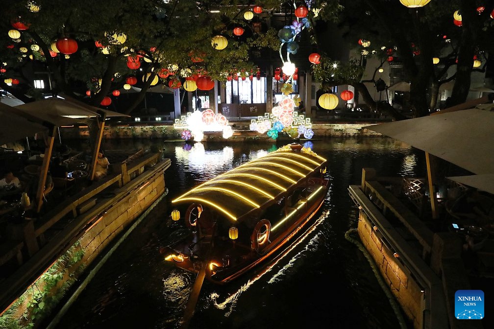 This photo taken on July 2, 2026 shows the night scenery in Huishan Yingyueli area in Wuxi City, east China's Jiangsu Province. Opened in 2025, the Huishan Yingyueli area, inspired by the famous Erhu solo piece Er Quan Ying Yue (Two Springs Reflecting the Moon), is now a beloved local leisure resort. (Xinhua/Lu Peng)