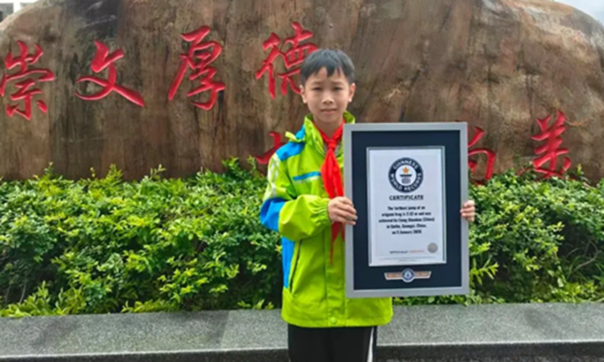 Photo of Liang Chenhao holding his Guinness World Record certificate Photo: Screenshot from media reports