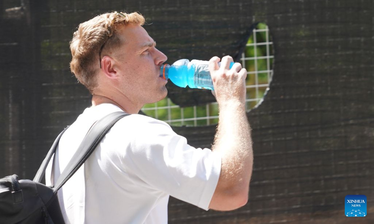 A man drinks water during a heat wave in New York, the United States, on July 2, 2026. (Xinhua/Zhang Fengguo)