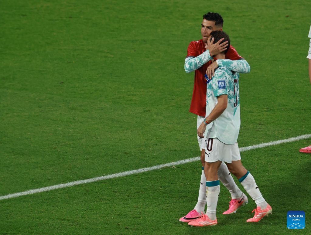 Cristiano Ronaldo (L) of Portugal hugs his teammate Bernardo Silva after winning the round of 32 match between Portugal and Croatia at the 2026 FIFA World Cup at Toronto Stadium in Toronto, Canada, July 2, 2026. (Photo by Yang Shu/Xinhua)