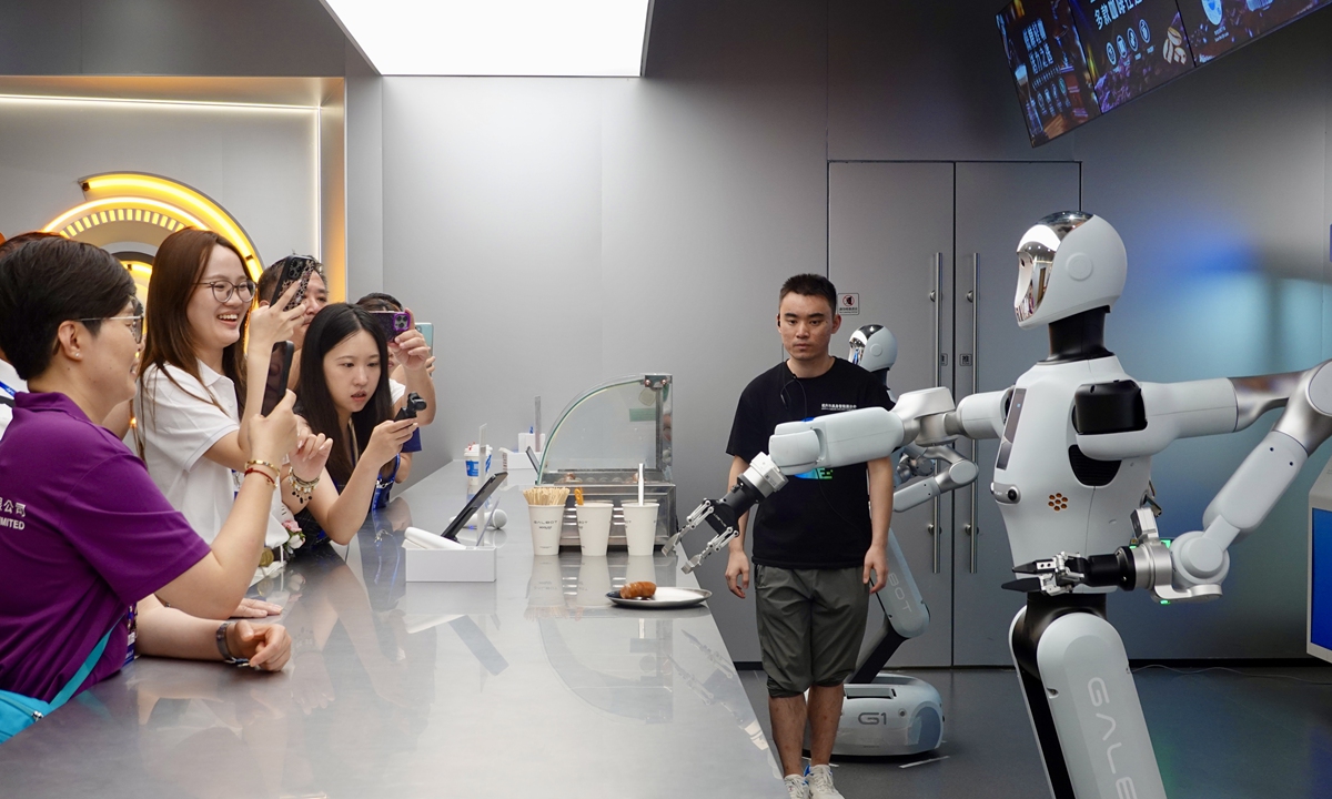 Participants in a tour for youth from the Hong Kong and Macao special administrative regions visit an embodied intelligence exhibition center in Hangzhou, East China's Zhejiang Province, on July 3, 2026, where those young talents experienced the city's vibrant technological innovation ecosystem. Photo: VCG