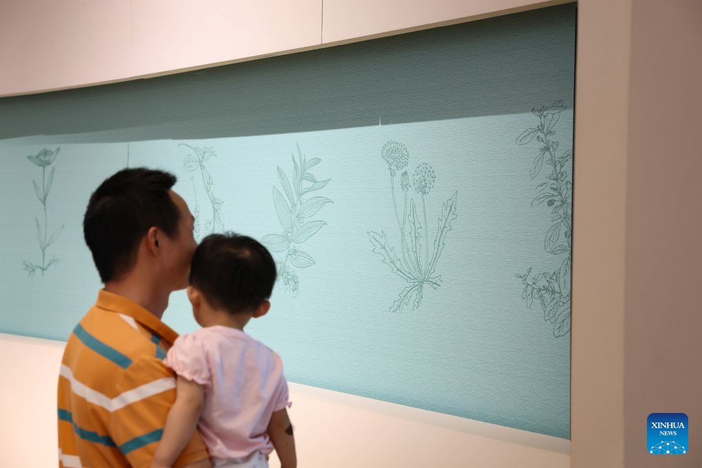Visitors view an exhibit at an experience center of Guangdong-Macao Traditional Chinese Medicine Technology Industrial Park in Hengqin, Zhuhai City, south China's Guangdong Province, July 2, 2026. Hengqin, located in Zhuhai, Guangdong Province, is separated from Macao by a narrow stretch of water. The Guangdong-Macao In-Depth Cooperation Zone in Hengqin was established in 2021 to facilitate Macao's better integration into the overall national development. (Xinhua/Zhang Yudong)