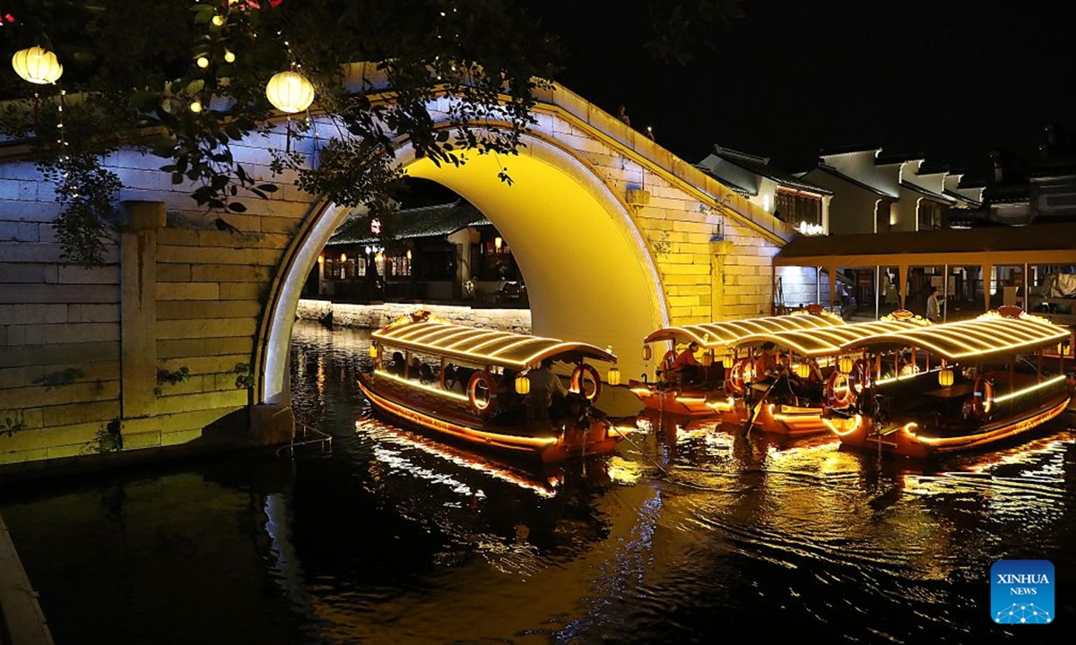This photo taken on July 2, 2026 shows the night scenery in Huishan Yingyueli area in Wuxi City, east China's Jiangsu Province. Opened in 2025, the Huishan Yingyueli area, inspired by the famous Erhu solo piece Er Quan Ying Yue (Two Springs Reflecting the Moon), is now a beloved local leisure resort. (Xinhua/Lu Peng)