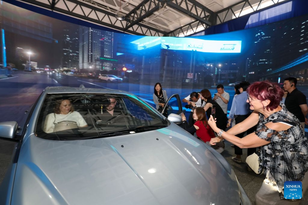 Foreign representatives attending the 4th China-Central and Eastern European Countries (CEEC) Spokespersons Dialogue experience virtual driving at the Shanghai International Short Video Center in Shanghai, east China, July 3, 2026. (Photo: Xinhua)
