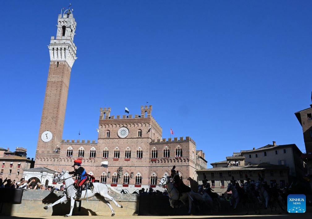 Italian Carabinieri, known as the gendarmerie of Italy, perform before the Palio in Siena, Italy, July 3, 2026. Palio in Siena, or Palio di Siena in Italian, is a historical horse race held twice a year in Siena since 1656. (Photo: Xinhua)