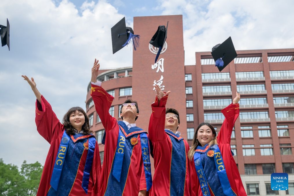 Students pose for photos after the graduation ceremony at Renmin University of China in Beijing, capital of China, July 4, 2026. Renmin University of China held the graduation ceremony on Saturday and saw about 8,244 graduates participating in the on-campus celebrations. (Photo: Xinhua)