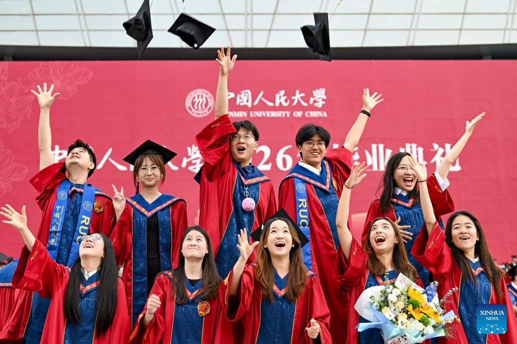 Students pose for photos after the graduation ceremony at Renmin University of China in Beijing, capital of China, July 4, 2026. Renmin University of China held the graduation ceremony on Saturday and saw about 8,244 graduates participating in the on-campus celebrations. (Photo: Xinhua)