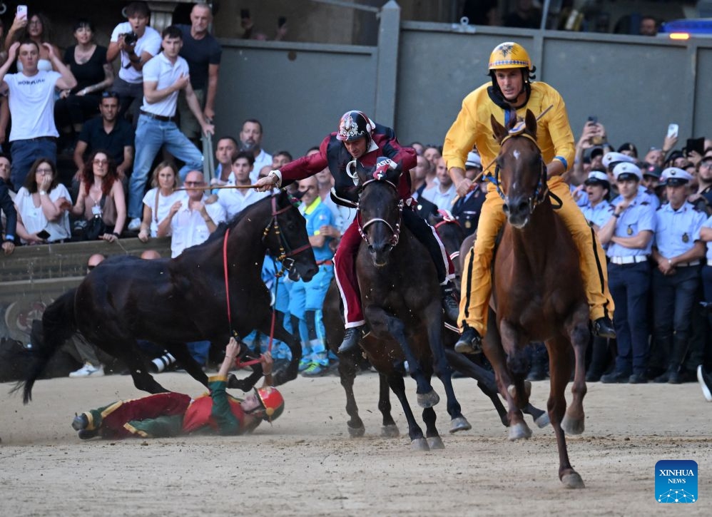 Palio jockeys compete during the Palio in Siena, Italy, July 3, 2026. Palio in Siena, or Palio di Siena in Italian, is a historical horse race held twice a year in Siena since 1656. (Photo: Xinhua)