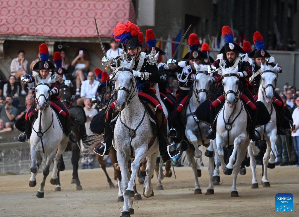 Italian Carabinieri, known as the gendarmerie of Italy, perform before the Palio in Siena, Italy, July 3, 2026. Palio in Siena, or Palio di Siena in Italian, is a historical horse race held twice a year in Siena since 1656. (Photo: Xinhua)