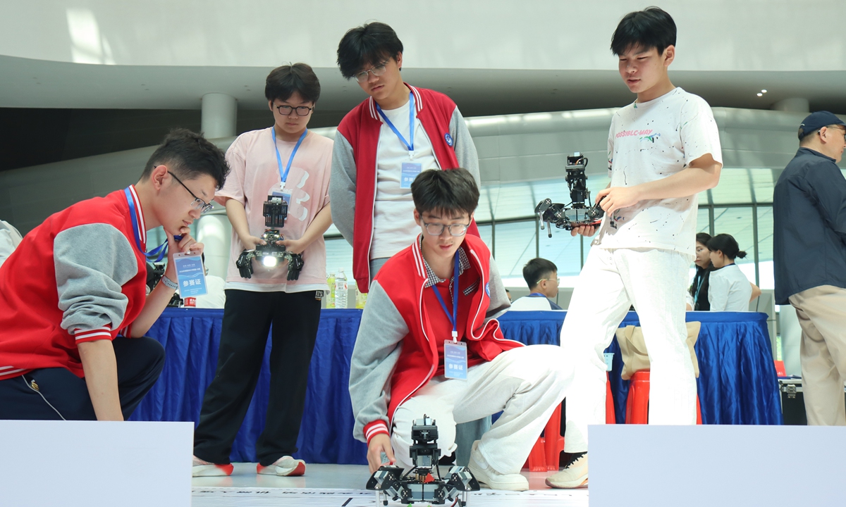 Teenage contestants take part in a robotics competition for primary and secondary school students in Fuyang, East China's Anhui Province on May 16, 2026. Photos on this page: VCG