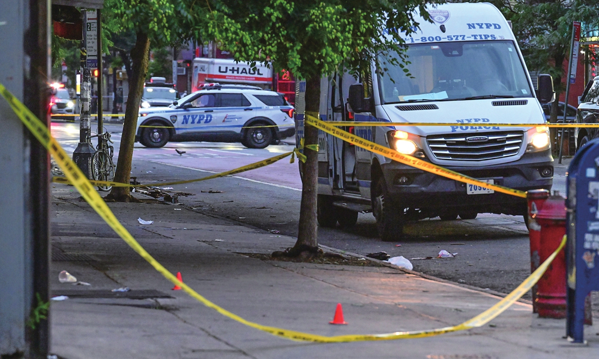 New York Police Department vehicles are parked at the scene where an officer was reportedly shot in his protective vest near Nostrand Avenue and St. John's Place in Brooklyn, New York, US, on July 5, 2026. Photo: VCG