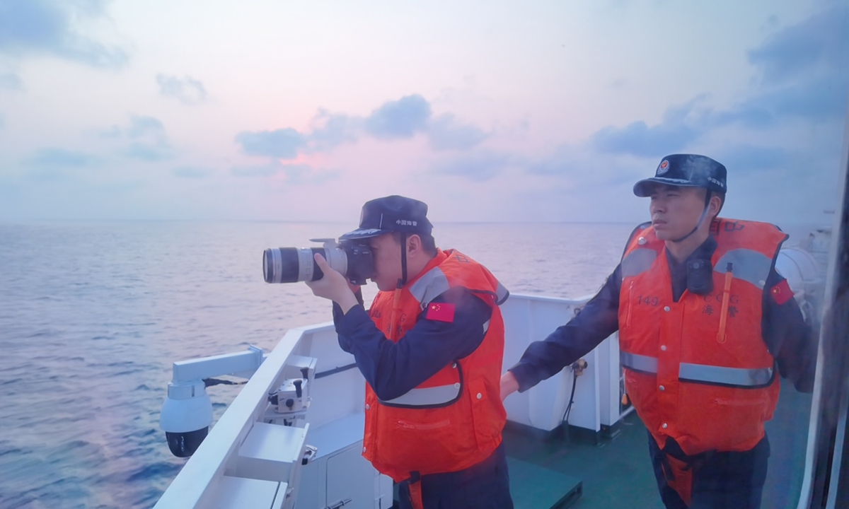 CCG officers aboard vessel Xiamen obtain evidence. Photo: Ding Yazhi/GT