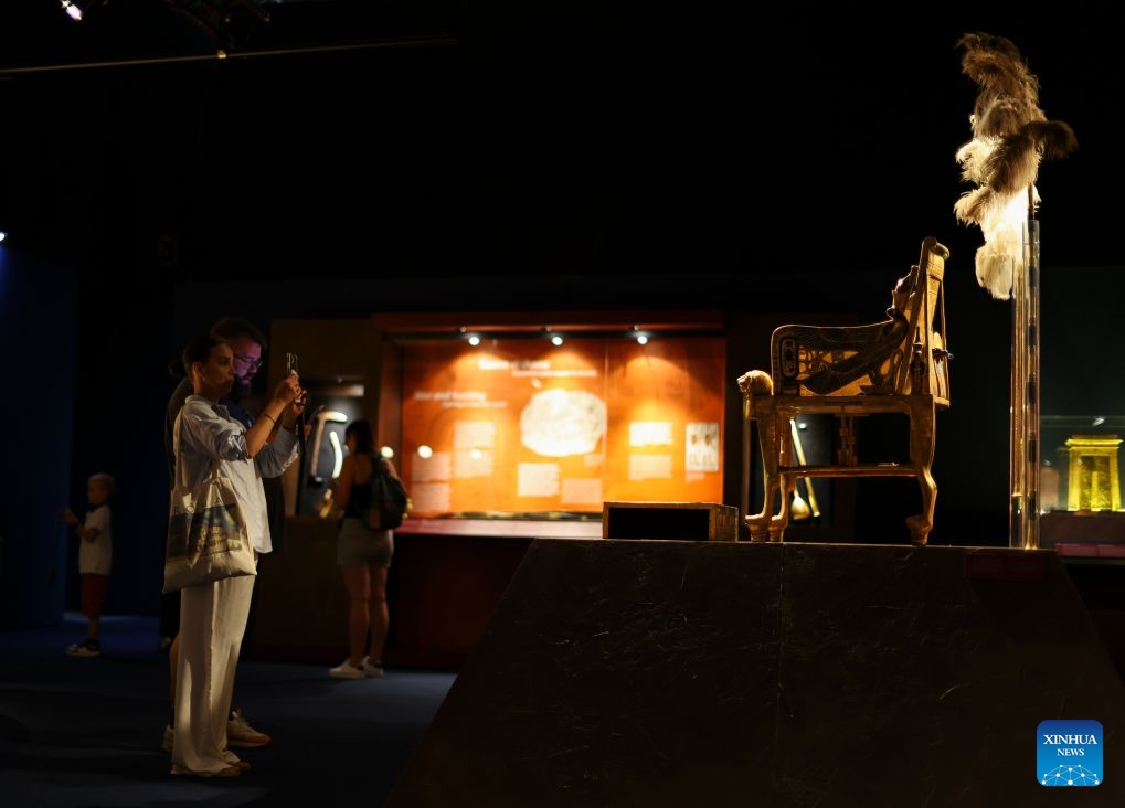 Visitors view the exhibition Tutankhamun - His Tomb and His Treasures in Paris, France, July 4, 2026. The exhibition runs from July 3 to Sept. 6, with more than 1,000 scientifically reconstructed replicas recreating the discovery of the tomb of the ancient Egyptian pharaoh Tutankhamun. (Xinhua/Wu Huiwo)