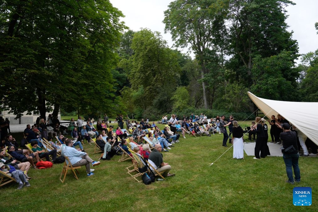 People attend an open-air summer music festival at the Lazienki Park in Warsaw, Poland, July 4, 2026. The annual open-air summer music festival is being held at the Lazienki Park. Running over four weekends from July 4 to 26 this year, the festival features free performances of classical, jazz and traditional music by Polish and international artists. (Photo by Jaap Arriens/Xinhua)