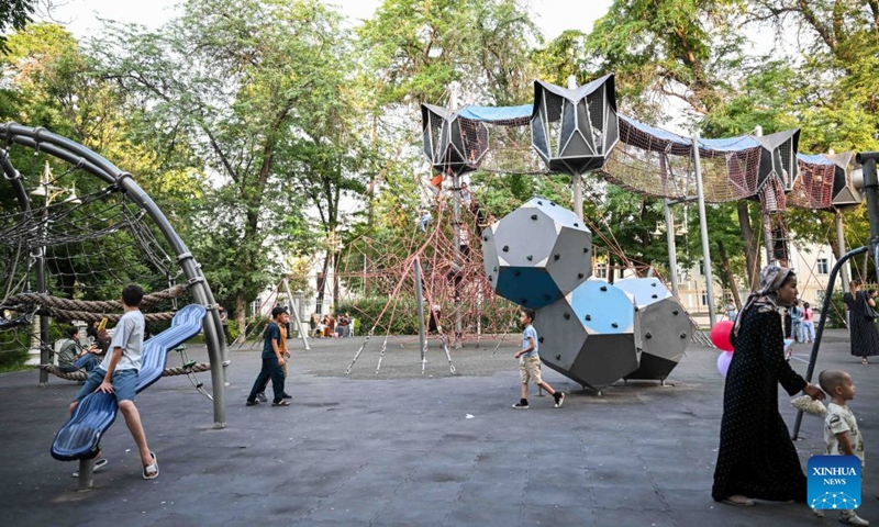 Children enjoy themselves on a playground at Ashgabat Park in Ashgabat, Turkmenistan, on July 4, 2026. (Photo by Cui Jiaxin/Xinhua)