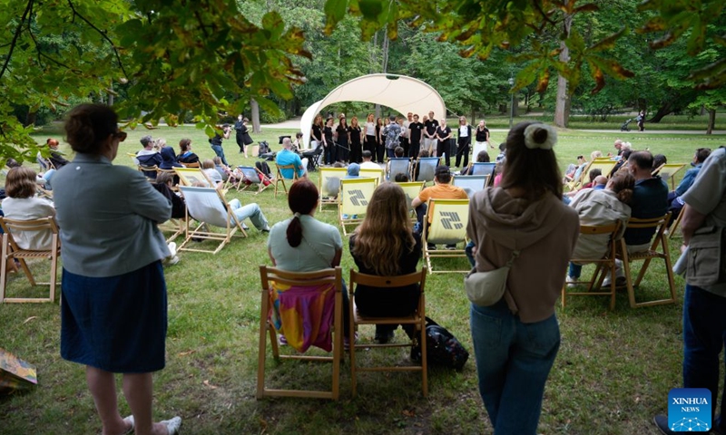 People attend an open-air summer music festival at the Lazienki Park in Warsaw, Poland, July 4, 2026. The annual open-air summer music festival is being held at the Lazienki Park. Running over four weekends from July 4 to 26 this year, the festival features free performances of classical, jazz and traditional music by Polish and international artists. (Photo by Jaap Arriens/Xinhua)