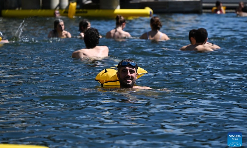People swim in the Seine River, Paris, France, on July 4, 2026. Paris opened some swimming sites in the Seine River to help people escape heat on Saturday. (Photo by Emma Da Silva/Xinhua)