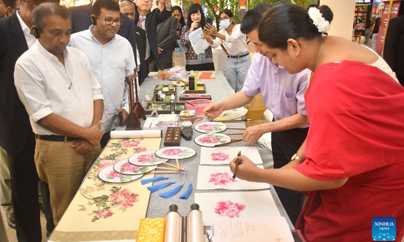Guests visit an exhibition during the cultural exchange event Encounter and Enlighten in Colombo, Sri Lanka, July 4, 2026. The cultural exchange event Encounter and Enlighten recently arrived in Colombo, Sri Lanka, featuring a themed dialogue with China's eastern city of Ningbo.(Photo by Ajith Perera/Xinhua)