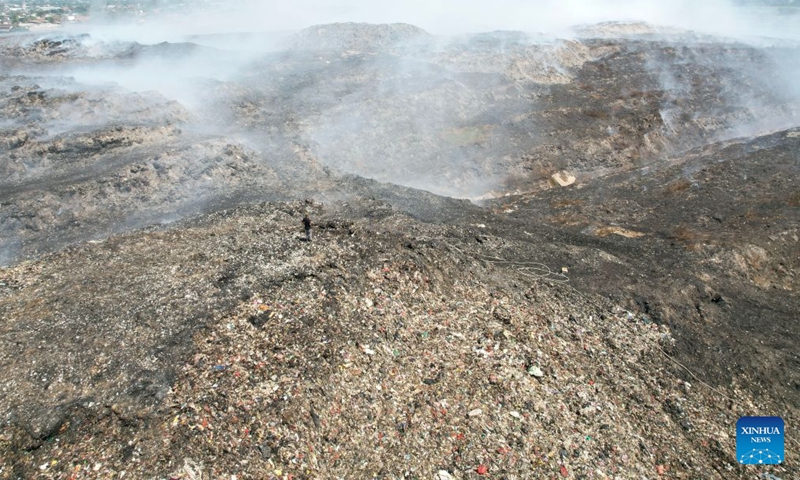 An aerial drone photo shows a smoldering landfill in Tangerang Regency, Banten Province, Indonesia on July 5, 2026.
