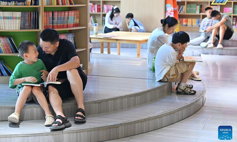 Children read books at a bookstore in Shangqiu, central China's Henan Province, July 4, 2026. (Photo by Li Heng/Xinhua)