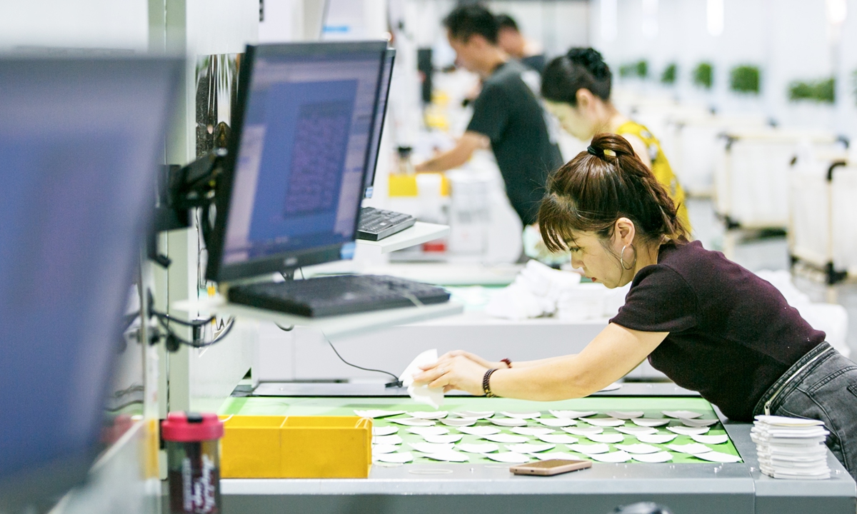 Workers operate on shoe production lines in a smart manufacturing workshop in Sui county, Central China's Henan Province, on July 6, 2026. In recent years, the region has pursued industrial relocation, transforming its footwear industry from almost nothing to scale and from scattered workshops to clustered production. 
Photo: VCG