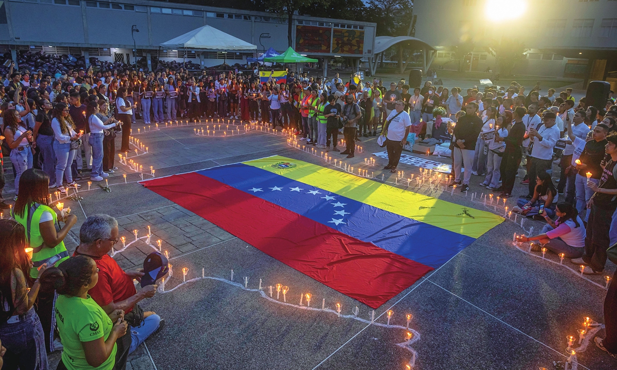 People take part in a vigil held in Caracas, Venezuela in honor of the victims of the recent earthquakes, on July 5, 2026. The magnitude 7.2 and 7.5 earthquakes struck on June 24, with the death toll rising to 3,342, according to media reports. Photo: VCG