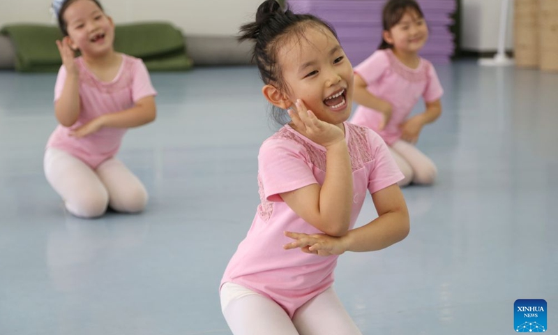 Children learn to dance at a youth palace in Mengzi, southwest China's Yunnan Province, July 5, 2026. (Photo by Xue Yingying/Xinhua)