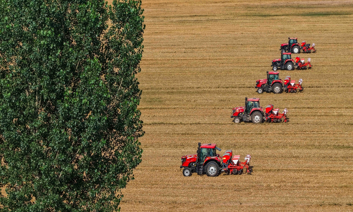 Farmers are busy working in the fields during the summer sowing season in Dongyujia village, Dezhou, East China's Shandong Province, on June 24, 2026. Photo: VCG