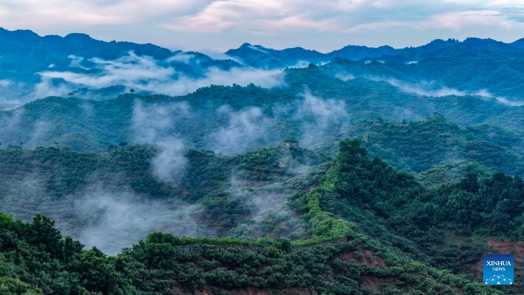 An aerial drone photo taken on July 6, 2026 shows the clouds scenery after rainfall at the ancient Great Wall at Zunhua City, north China's Hebei Province. (Photo: Xinhua)