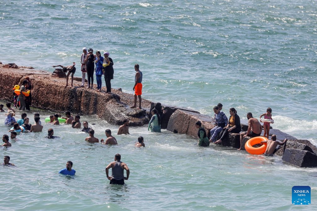 People cool off on a beach along the Mediterranean coast during a heatwave in Alexandria, Egypt, on July 6, 2026. (Photo: Xinhua)