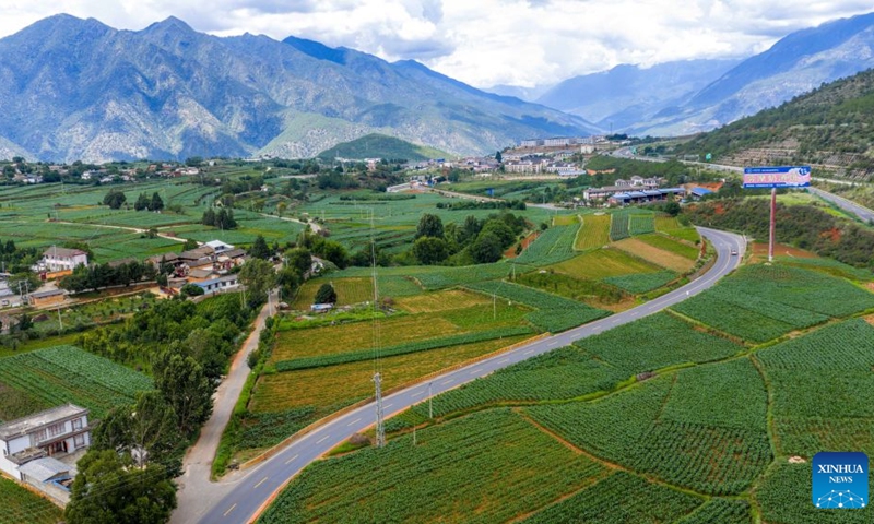 An aerial drone photo taken on July 4, 2026 shows a section of the old Yunnan-Xizang road (L) and a section of the Yunnan-Xizang Highway in Yulong Naxi Autonomous County of Lijiang, southwest China's Yunnan Province. Fifty years ago on this day, the Yunnan-Xizang Highway, a vital trunk road in China's southwestern border regions, was fully completed and opened to traffic. (Photo: Xinhua)