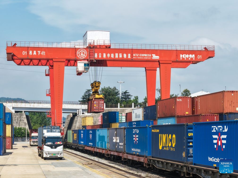 A drone photo shows a crane lifting containers at the China-Kazakhstan (Lianyungang) Logistics Cooperation Base in Lianyungang, east China's Jiangsu Province, July 6, 2026. An international freight train loaded with auto parts departed from the China-Kazakhstan (Lianyungang) Logistics Cooperation Base for Uzbekistan on Monday, marking the 8,000th international freight train handled by the base since its operation. (Photo: Xinhua)