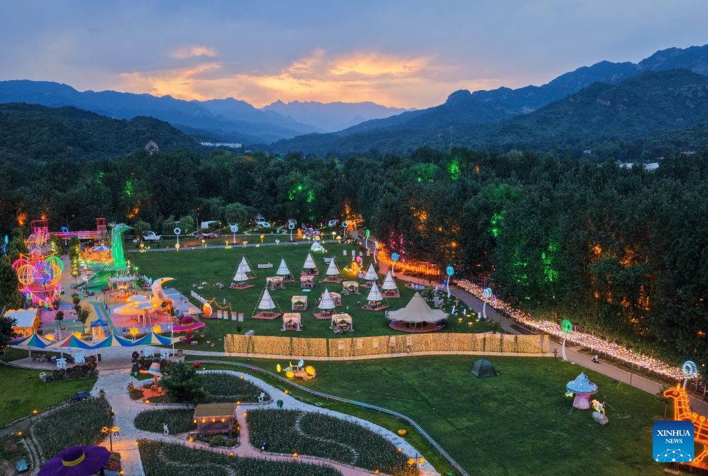 A drone photo shows the scenery at a camping site in Lingshou County of Shijiazhuang, north China's Hebei Province, July 4, 2026. Shijiazhuang has developed a camping-based tourism brand to enrich short-getaway options for tourists, boost consumption and promote rural revitalization. (Photo: Xinhua)