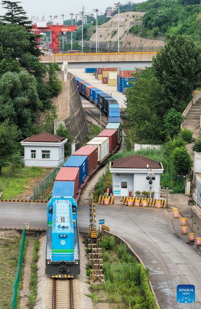 An aerial drone photo shows an international freight train loaded with auto parts departing from the China-Kazakhstan (Lianyungang) Logistics Cooperation Base in Lianyungang, east China's Jiangsu Province, July 6, 2026. An international freight train loaded with auto parts departed from the China-Kazakhstan (Lianyungang) Logistics Cooperation Base for Uzbekistan on Monday, marking the 8,000th international freight train handled by the base since its operation. (Photo: Xinhua)