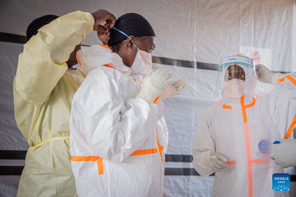 Medical workers put on protective suits at an Ebola treatment center in Bunia, the capital of Ituri Province in the Democratic Republic of the Congo, July 6, 2026. The death toll from the latest Ebola outbreak in the Democratic Republic of the Congo has surpassed 500, according to a report released Sunday by the country's health authorities. (Photo: Xinhua)